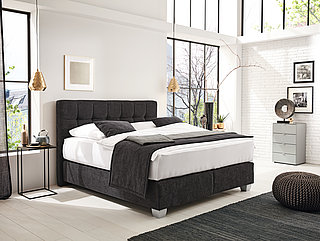 Felina Basic box-spring bed, headboard 1, approx. H 124 cm, fabric D 040 anthracite, FT1 base in silver, accessories: two throws, cushions approx. 180 x 200, outer dimensions W/L approx. 215/218 cm (bed), H approx. 124 cm (headboard), 240 x 70 cm (throws), 40 x 60 cm (cushions) fabric D 040 anthracite, except 1 throw D 038 (both fabrics 86% polyester/14% nylon)